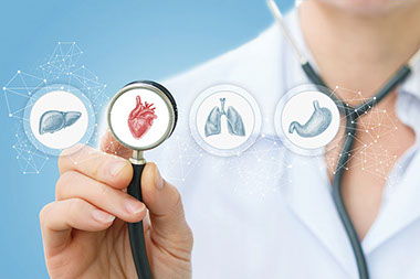 Concept image of doctor with icons of different human organs.