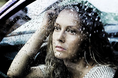 Image of young women looking out the car window.