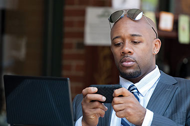 What do you do 100 times a day? Image of man on his smart phone.
