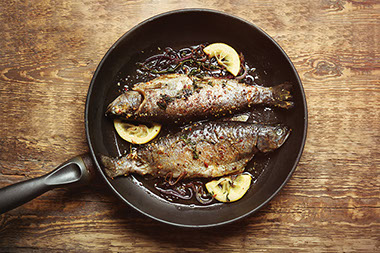 Fish in frying pan. Fish in frying pan.