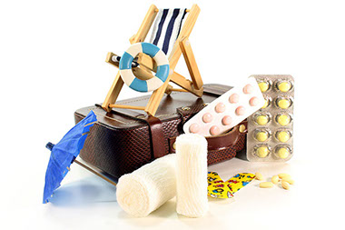 Image of medication with miniature suitcase and beach chair.