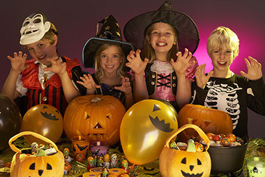 Image of children in halloween customs.