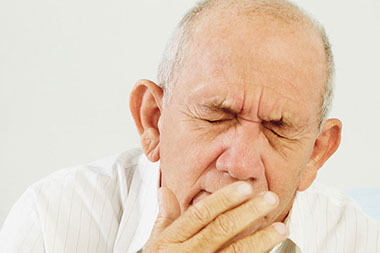 Image of man experiencing mouth pain.