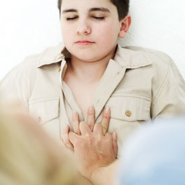 CPR. Image of child chest compressions.